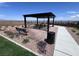 Community pergola with seating, landscaping, and mountain views at 2194 Pigeon Hawk St, Las Vegas, NV 89138