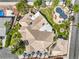 Stunning aerial view of the expansive home featuring a pool, lush landscaping, and inviting outdoor spaces at 2201 Country Cottage Ct, Las Vegas, NV 89117