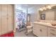 Bright bathroom featuring modern vanity, stylish decor, and spacious storage cabinets at 2201 Country Cottage Ct, Las Vegas, NV 89117