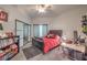 Cozy bedroom featuring a modern closet, stylish curtains, and bright natural light at 2201 Country Cottage Ct, Las Vegas, NV 89117