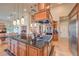 Gourmet kitchen features a large center island, stainless steel appliances, and custom cabinetry at 2201 Country Cottage Ct, Las Vegas, NV 89117