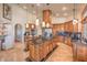 Spacious kitchen with custom cabinetry, granite countertops, and large island with seating at 2201 Country Cottage Ct, Las Vegas, NV 89117