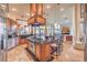 Open-concept kitchen flows into the living area with a large center island and stainless appliances at 2201 Country Cottage Ct, Las Vegas, NV 89117