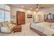 Cozy main bedroom features a ceiling fan, carpet, and an abundance of windows for natural light at 2201 Country Cottage Ct, Las Vegas, NV 89117