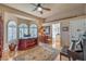 Stylish home office boasts natural light with plantation shutters and adjacent bath access at 2201 Country Cottage Ct, Las Vegas, NV 89117