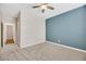 Bedroom features carpet, walk-in closet, neutral paint, and ceiling fan at 234 Polaris Ridge Ave, Henderson, NV 89011