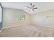 Light-filled bedroom offers neutral carpeting, bright windows, and a modern ceiling fan at 234 Polaris Ridge Ave, Henderson, NV 89011