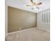 Comfortable bedroom with plush carpeting, ceiling fan, and a bright window with shutters at 234 Polaris Ridge Ave, Henderson, NV 89011