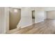 Bright hallway with wood-look flooring and access to additional rooms, bathed in natural light at 234 Polaris Ridge Ave, Henderson, NV 89011