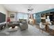 A cozy living room offers a minibar, comfortable sectional couch, entertainment center, and neutral decor at 234 Polaris Ridge Ave, Henderson, NV 89011