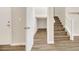 Open staircase with wood steps, leading to the next level, also features storage underneath at 234 Polaris Ridge Ave, Henderson, NV 89011