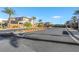 Street view of the community with lush landscaping and palm trees at 234 Polaris Ridge Ave, Henderson, NV 89011