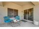 Cozy back patio offers seating and a sliding door to the home's interior at 2545 Banora Point Dr, Las Vegas, NV 89134