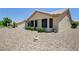 Exterior view shows well-maintained desert landscaping surrounding the single-story home at 2545 Banora Point Dr, Las Vegas, NV 89134
