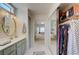Bathroom with a vanity, mirror, and access to the Primary bedroom and large walk-in closet at 2545 Banora Point Dr, Las Vegas, NV 89134