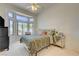 Cozy bedroom with large bay window, vaulted ceiling, and a neutral color palette at 2545 Banora Point Dr, Las Vegas, NV 89134