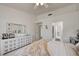 Spacious bedroom with neutral decor and an ensuite bathroom at 2545 Banora Point Dr, Las Vegas, NV 89134