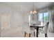 Bright dining room with ample natural light, showcasing an open floor plan at 2545 Banora Point Dr, Las Vegas, NV 89134