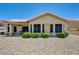 Charming single-story home featuring a tile roof, gravel landscaping, and a cozy covered patio area at 2545 Banora Point Dr, Las Vegas, NV 89134