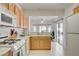Well-maintained kitchen with views through the pass-through window to a sunroom at 2545 Banora Point Dr, Las Vegas, NV 89134