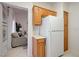 Galley kitchen leads to a cozy living space, showcasing a practical layout and ample storage at 2545 Banora Point Dr, Las Vegas, NV 89134