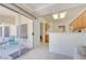 Bright kitchen transitions to sunroom with tile floors and sliding glass doors for easy entertaining at 2545 Banora Point Dr, Las Vegas, NV 89134