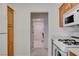 View from kitchen towards hallway and appliances at 2545 Banora Point Dr, Las Vegas, NV 89134
