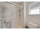 Updated bathroom with a walk-in shower, modern fixtures, and frosted glass door for privacy at 2545 Banora Point Dr, Las Vegas, NV 89134