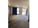 Interior view of the living room with wood paneled wall and a large window at 2642 San Vincente Ct, Las Vegas, NV 89115