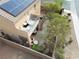 A home with solar panels and a patio balcony overlooking a well-maintained backyard at 2691 Benton Cove St, Laughlin, NV 89029