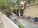 The backyard offers a peaceful retreat with desert landscaping and outdoor seating area at 2691 Benton Cove St, Laughlin, NV 89029
