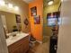 Bright bathroom featuring a single sink vanity, decorative accents, and a walk-in shower at 2691 Benton Cove St, Laughlin, NV 89029