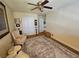 Relaxing bedroom with ceiling fan, comfortable chairs, and soft lighting at 2691 Benton Cove St, Laughlin, NV 89029