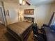Comfortable bedroom featuring a cozy queen bed, ceiling fan, and classic interior design at 2691 Benton Cove St, Laughlin, NV 89029