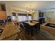 Inviting dining room with stylish chandelier, comfortable seating, and modern decor at 2691 Benton Cove St, Laughlin, NV 89029