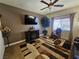 Comfortable living room with a ceiling fan, a large TV, and decorative furnishings at 2691 Benton Cove St, Laughlin, NV 89029