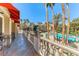Balcony overlooking the pool area with ornate railings and outdoor seating at 270 E Flamingo Rd # 107, Las Vegas, NV 89169