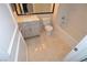 Well-lit bathroom with stylish vanity, mirror, and tiled floors at 270 E Flamingo Rd # 107, Las Vegas, NV 89169