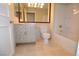 Bathroom with vanity, mirror, tub and tiled floors at 270 E Flamingo Rd # 107, Las Vegas, NV 89169
