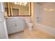 Bathroom featuring updated vanity, mirror, tub, and tile flooring at 270 E Flamingo Rd # 107, Las Vegas, NV 89169