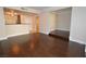 Open-concept living room with dark hardwood floors and easy access to other rooms at 270 E Flamingo Rd # 107, Las Vegas, NV 89169