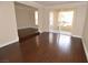 Open living room with wood floors and sliding glass doors to outdoor balcony at 270 E Flamingo Rd # 107, Las Vegas, NV 89169