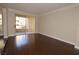 Bright living room features wood floors, and sliding glass doors to a balcony at 270 E Flamingo Rd # 107, Las Vegas, NV 89169
