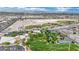 Aerial view of a community park showcasing athletic fields, tennis courts, and a recreation center at 3150 Soft Breezes Dr # 1040, Las Vegas, NV 89128