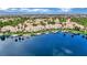 Scenic aerial view of lakeside homes, docks, and lush landscaping, creating a serene waterfront community at 3150 Soft Breezes Dr # 1040, Las Vegas, NV 89128