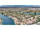 Breathtaking aerial view of a vibrant residential community nestled around a scenic lake at 3150 Soft Breezes Dr # 1040, Las Vegas, NV 89128