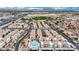 Aerial view of community featuring terracotta roofs, lush landscaping, and a pool at 3150 Soft Breezes Dr # 1040, Las Vegas, NV 89128