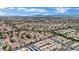 Expansive aerial view of a neighborhood with uniform architecture and well-spaced homes, showcasing a sense of community at 3150 Soft Breezes Dr # 1040, Las Vegas, NV 89128