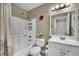 Cozy bathroom with a shower-tub combo, framed mirror and single sink vanity at 3150 Soft Breezes Dr # 1040, Las Vegas, NV 89128