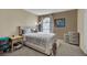Cozy bedroom with plush carpeting, comfortable bed, and decorative window at 3150 Soft Breezes Dr # 1040, Las Vegas, NV 89128